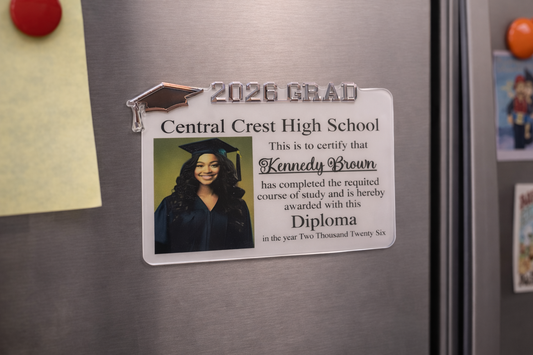 Graduation magnet on a refrigerator with a photo of a graduate and text. Graduation magnet on a refrigerator with a photo of a graduate and text.