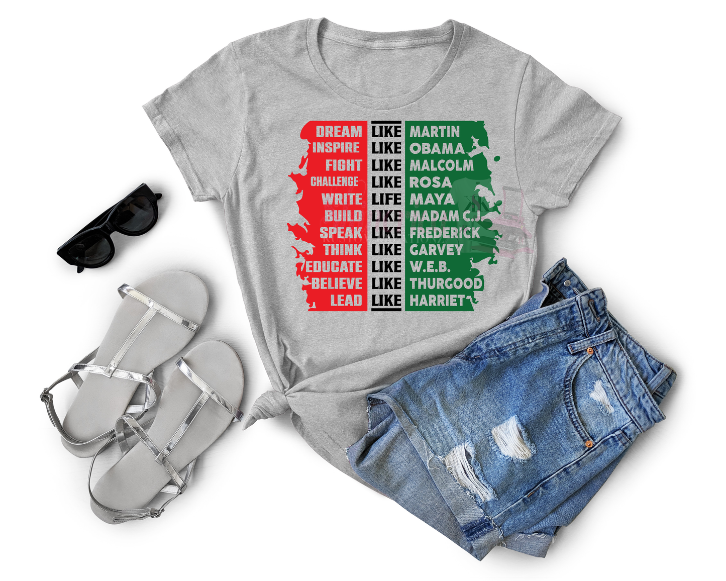 A gray t-shirt with a graphic print featuring names and hashtags related to black leaders like Martin Luther King and Malcolm X.