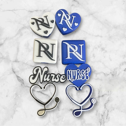 Collection of RN and Nurse-themed 3D printed straw toppers on a marble surface
