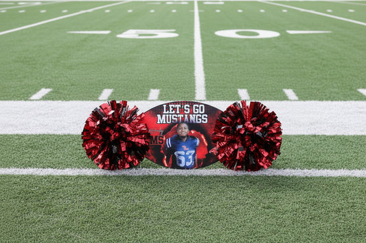 Cheerleading pom-pom with 'Let's Go Mustangs' text and a photo of a person on a grass background
