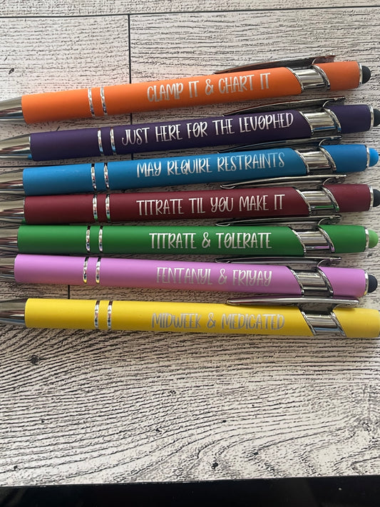 Set of colorful pens with engraved text about icu nurse on a textured surface