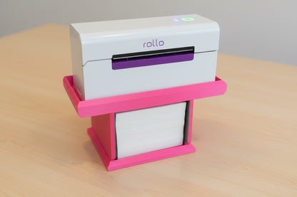 White and purple rollo printer on pink printer stand