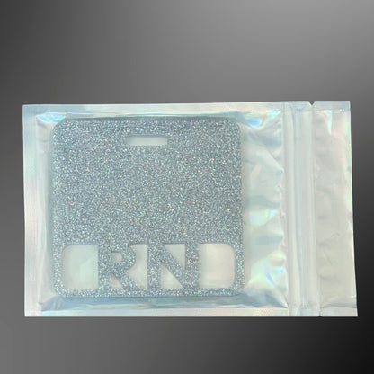 Silver glittery RN badge mate in a clear pouch 