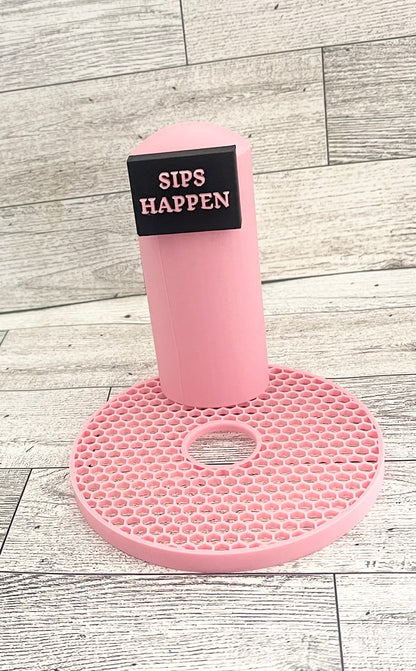 A pink 3D printed slushi maker handle with the text 'SIPS HAPPEN' printed on it.