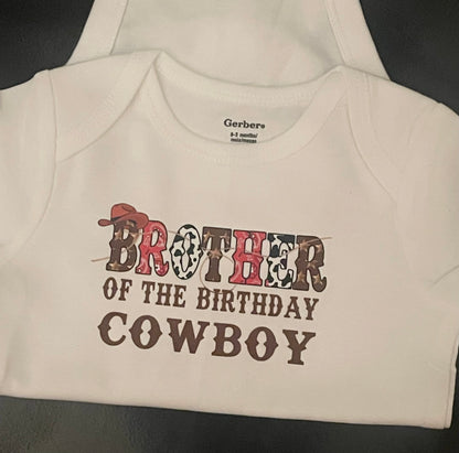 Baby onesie with 'Brother of the Birthday Cowboy' text on a plain background