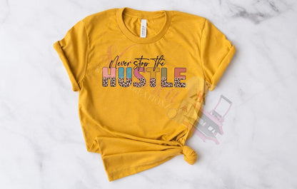 A yellow t-shirt with the text 'NEVER STOP THE HUSTLE' printed on the front.