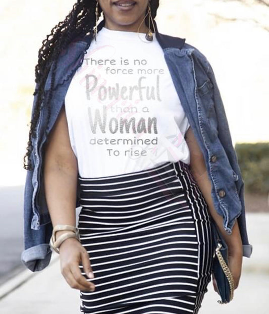 A woman wearing a white t-shirt with text that reads 'There is no force more powerful than a woman determined to rise.'