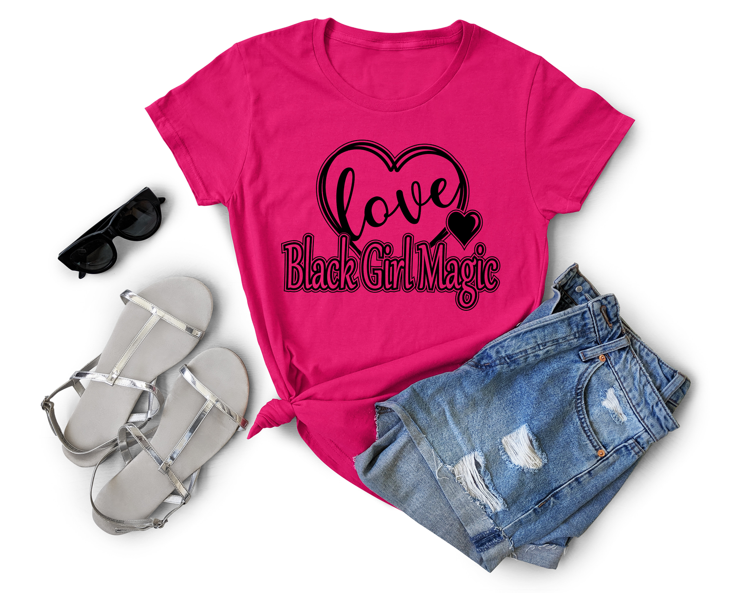 A pink t-shirt with 'Black Girl Magic' and 'LOVE' text design.