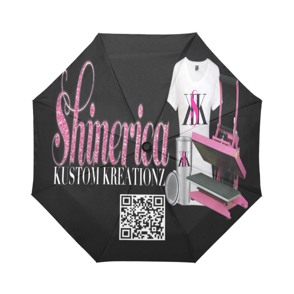 A custom umbrella with a black canopy and pink details, featuring text and a QR code on the handle.