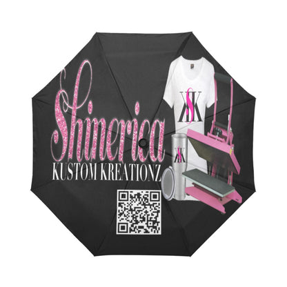 A custom umbrella with a black canopy and pink details, featuring text and a QR code on the handle.